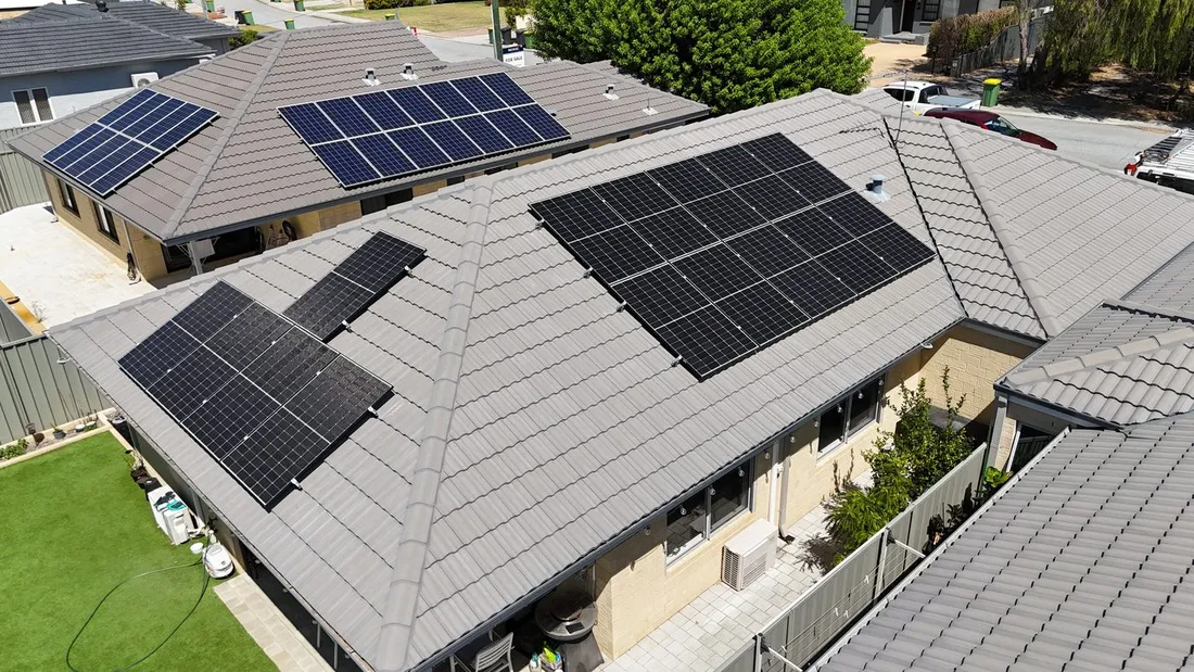 A tidy solar array on a grey tile roof, seen from above