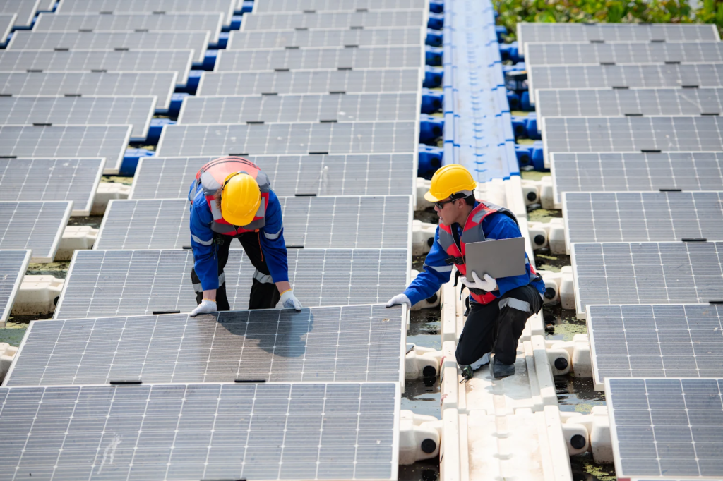 Two solar panel installers in Rockingham installing a Solar Rockingham system.