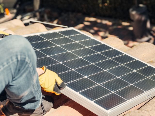Solar batteries for home energy storage system installed alongside residential solar panels.